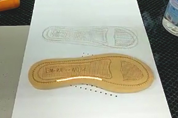 Laser engraving the brand LOGO on the insole